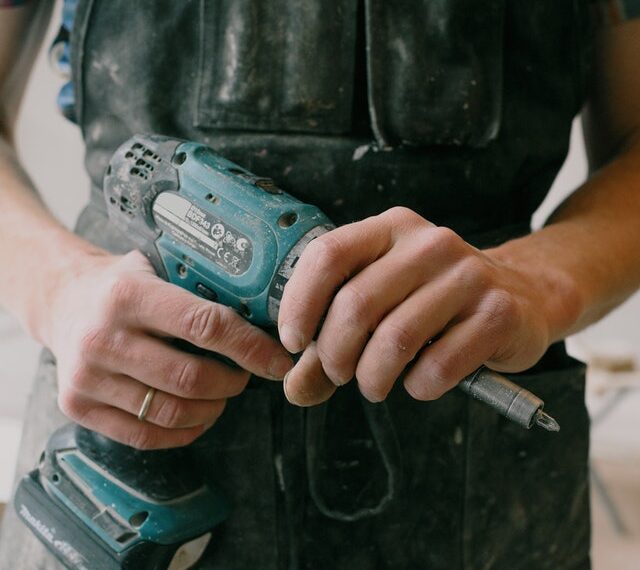man holding cordless drill