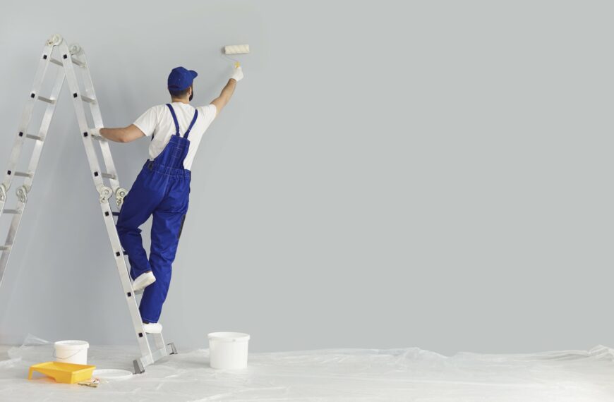 Handyman painting a wall