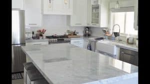 Kitchen with white granite counters
